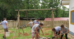 volunteers in laos build bamboo playground