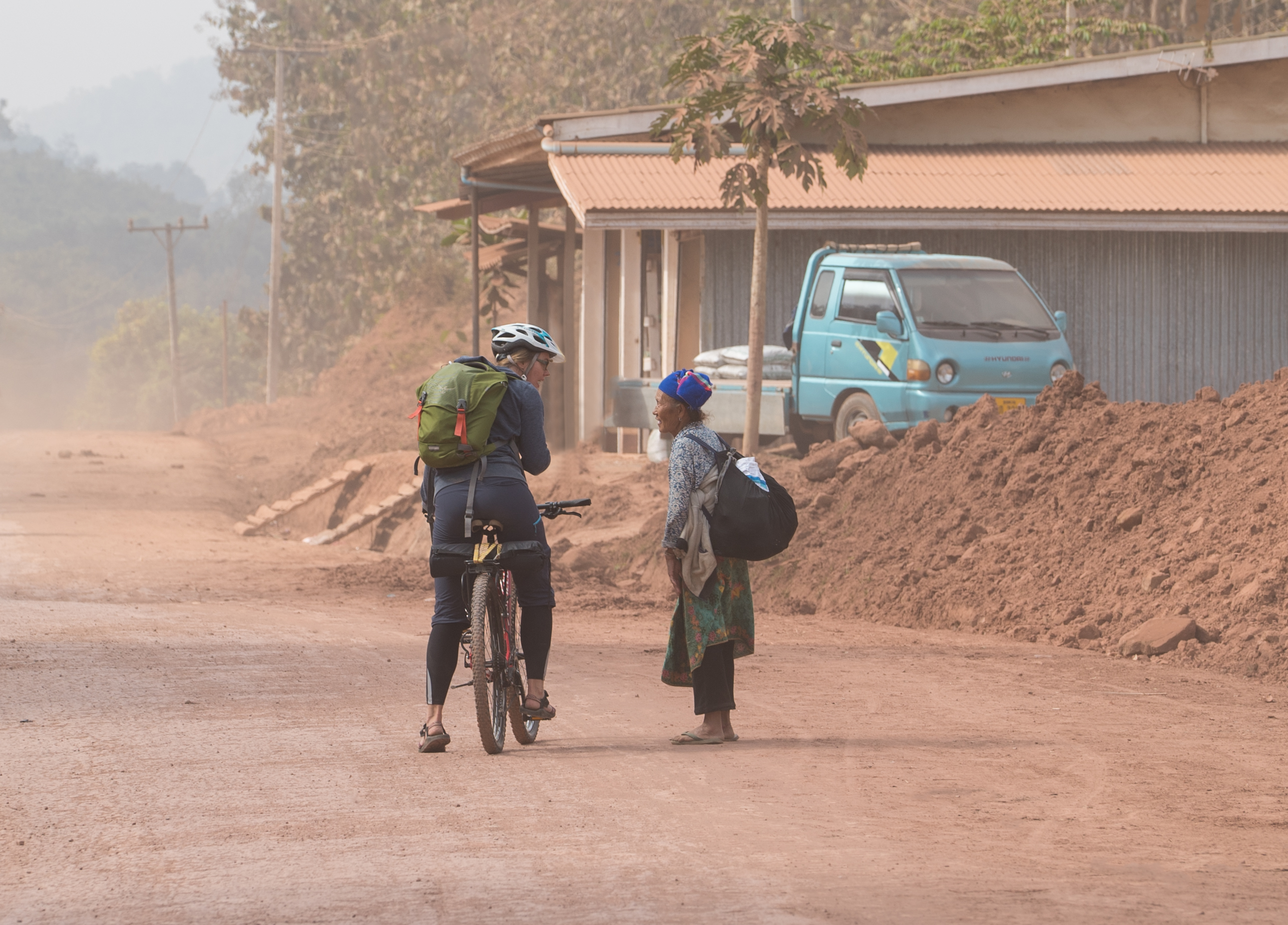 laos-biking-bicycle-cycling-lao-pdr-dirt-road-local-villager